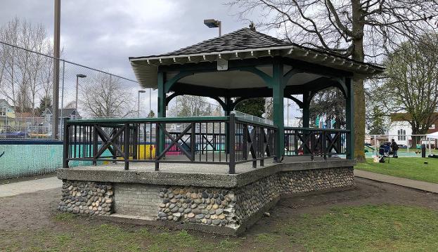 Clark Park Gazebo with brightly painted tennis court wall behind it